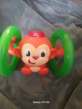 Orange Monkey Roll & Rattle Toy with Green Wheels
